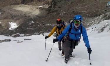 climbers on the trail to cholatse