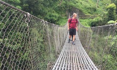 crossing suspension bridge near jhinu hotspring