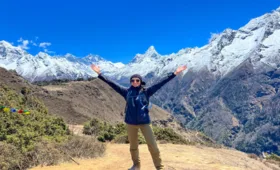 Posing infront of everest region mountains during everest base camp short trekking