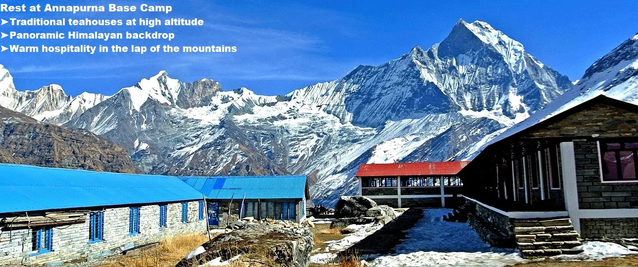 A traditional teahouse stands peacefully along the annapurna trek nepal, with the snow-covered peaks of mount annapurna forming a stunning backdrop.