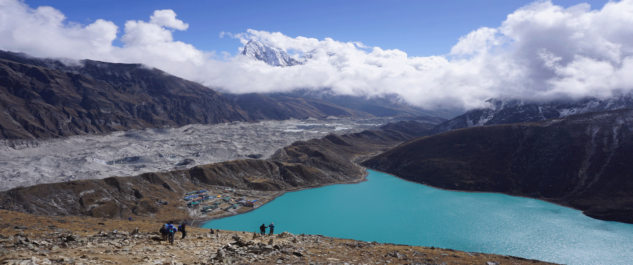 Gokyo lake trek showcasing the turquoise gokyo lake with ngozumpa glacier and surrounding himalayan peaks.